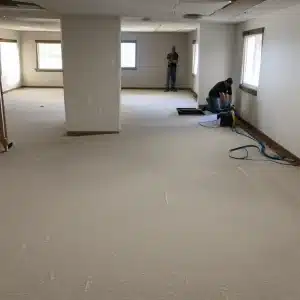 A basement carpet installation in progress