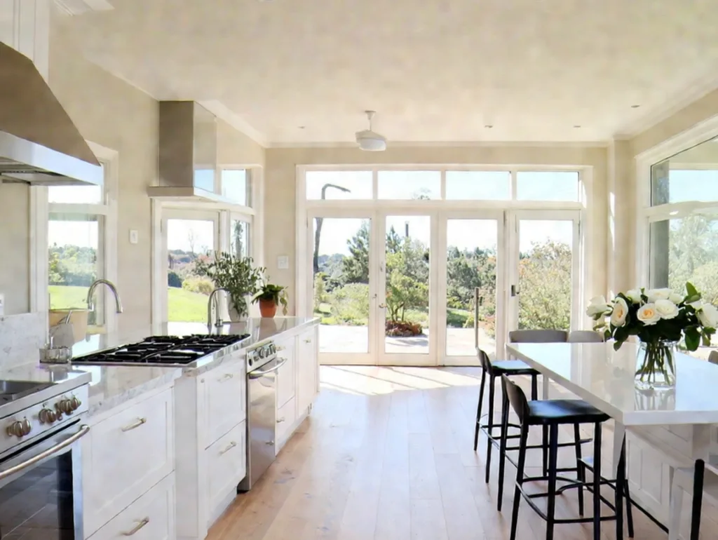 Vinyl vs. Laminate - a spacious, bright kitchen with light laminate flooring